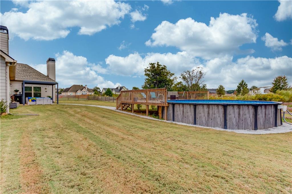 612 Quail Court Good Hope, GA 30641 - Photo 35 of 40 a view of a house next to a lake