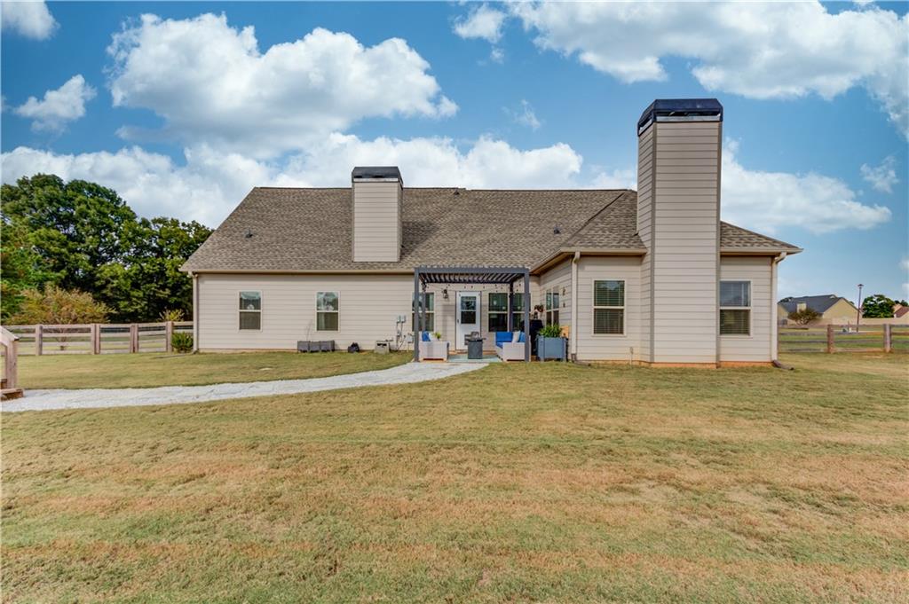 612 Quail Court Good Hope, GA 30641 - Photo 37 of 40 a front view of a house with a garden and plants