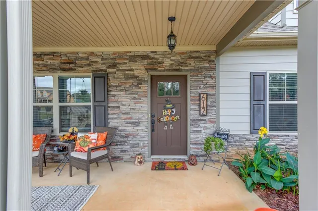 a outdoor living space with patio furniture and potted plants