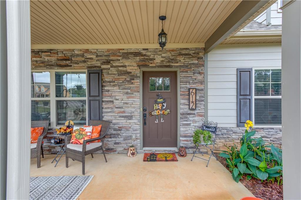 612 Quail Court Good Hope, GA 30641 - Photo 4 of 40 a outdoor living space with patio furniture and potted plants