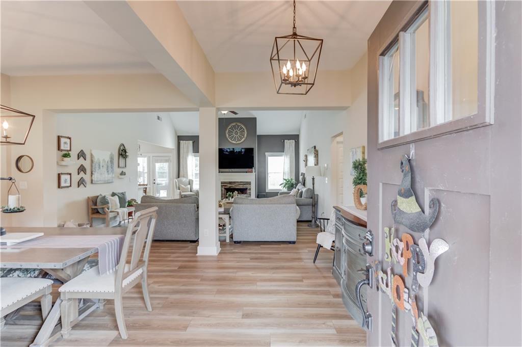 612 Quail Court Good Hope, GA 30641 - Photo 6 of 40 a view of a dining room with furniture and wooden floor