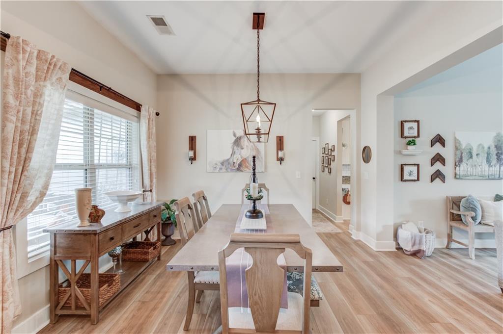 612 Quail Court Good Hope, GA 30641 - Photo 7 of 40 a view of a dining room with furniture window and wooden floor