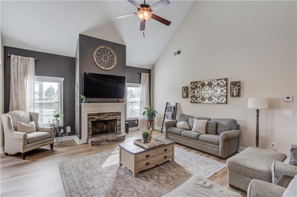 612 Quail Court Good Hope, GA 30641 - Photo 10 of 40 a living room with furniture and a fireplace