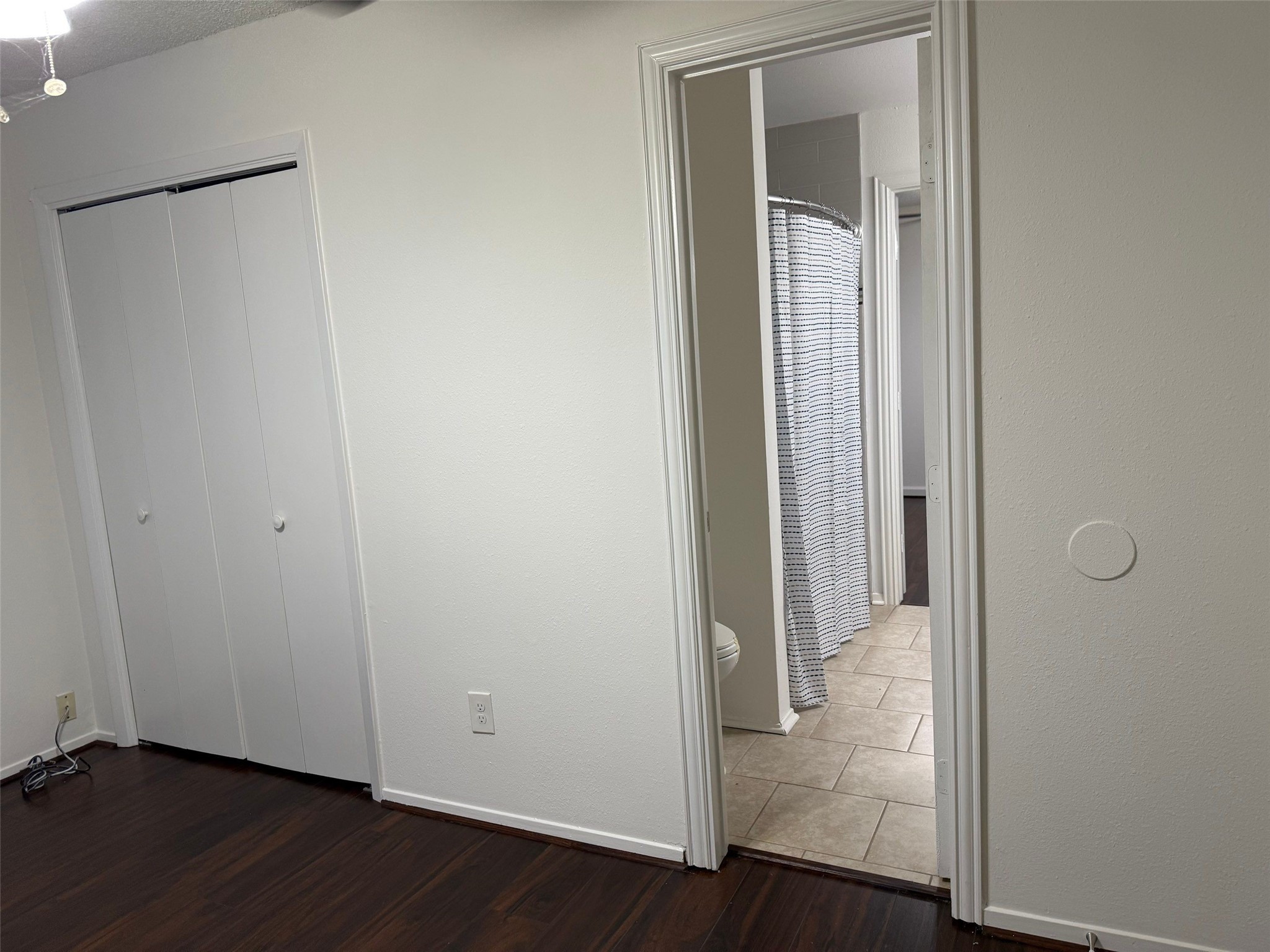 9626 Magnolia Ridge Drive Houston, TX 77070 - Photo 30 of 40 an empty room with wooden floor and closet