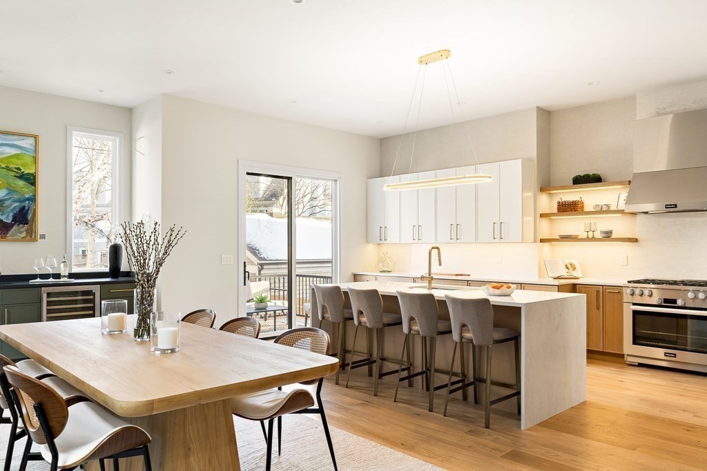 a view of a dining room with furniture and wooden floor