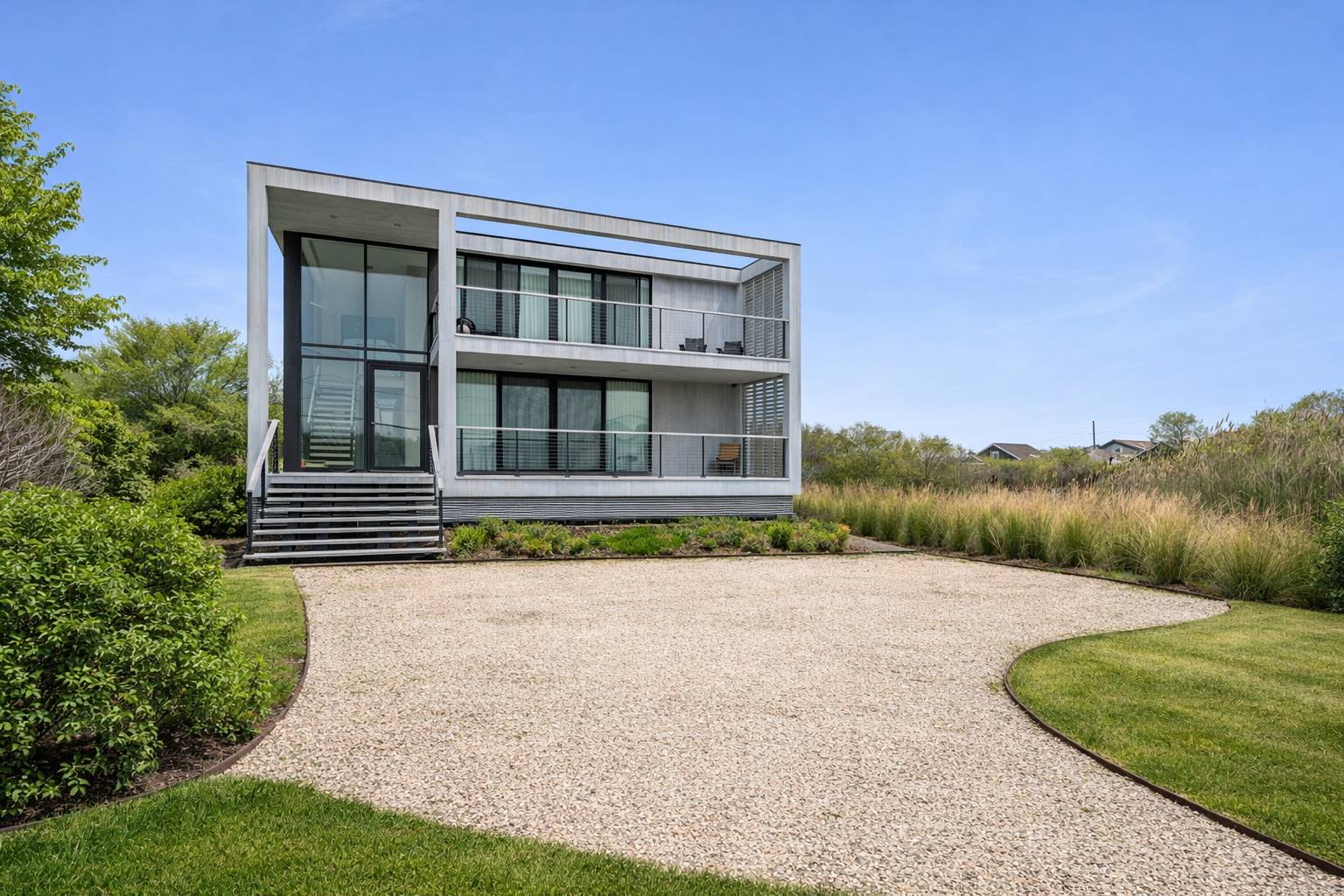 15 Deforest Road Montauk, NY 11954 - Photo 3 of 22 a front view of a house with a yard