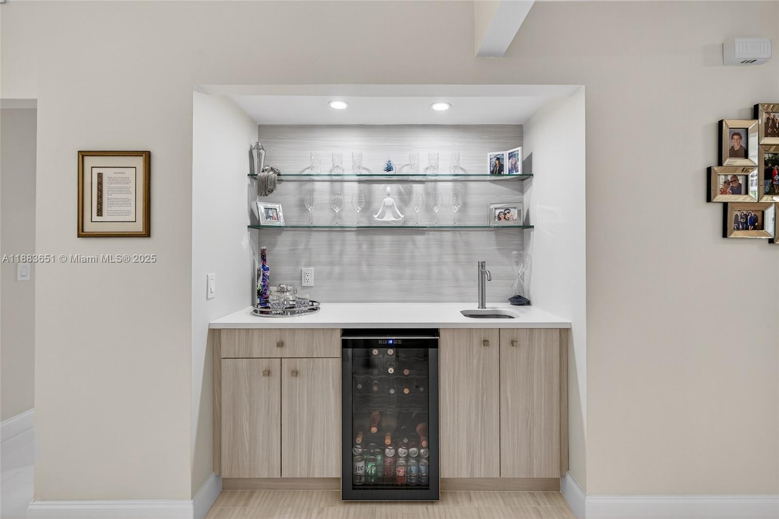 21695 Arriba Real Boca Raton, FL 33433 - Photo 19 of 61 a kitchen with a sink and cabinets