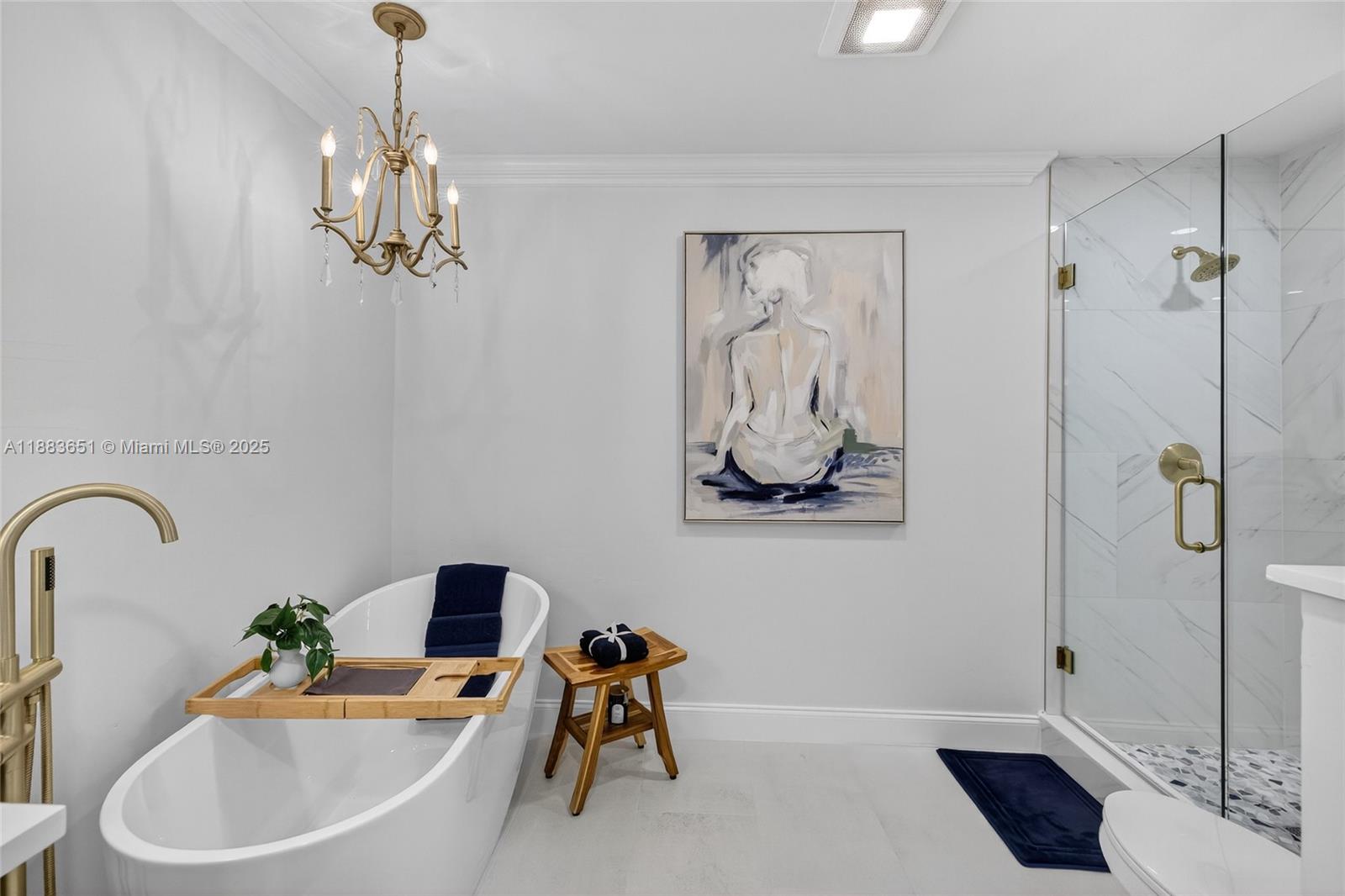 21695 Arriba Real Boca Raton, FL 33433 - Photo 24 of 61 a white bath tub sitting next to a bathroom sink