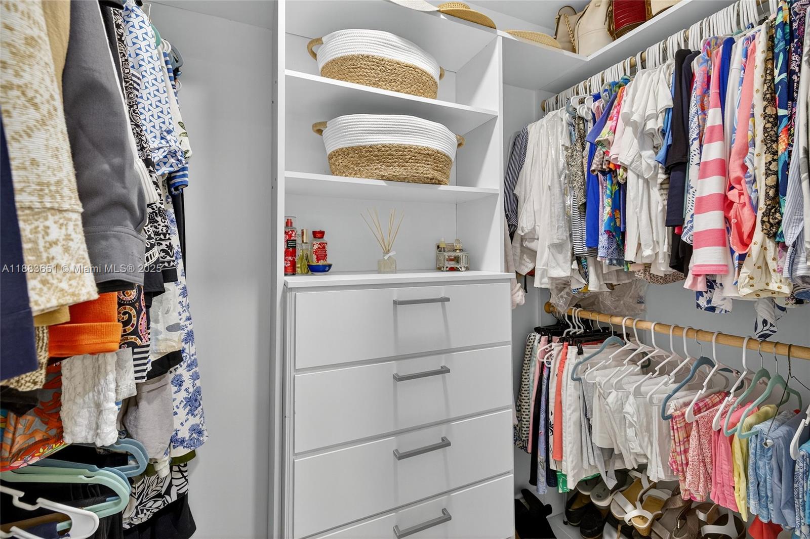 21695 Arriba Real Boca Raton, FL 33433 - Photo 28 of 61 a view of walk in closet with clothes and shoes