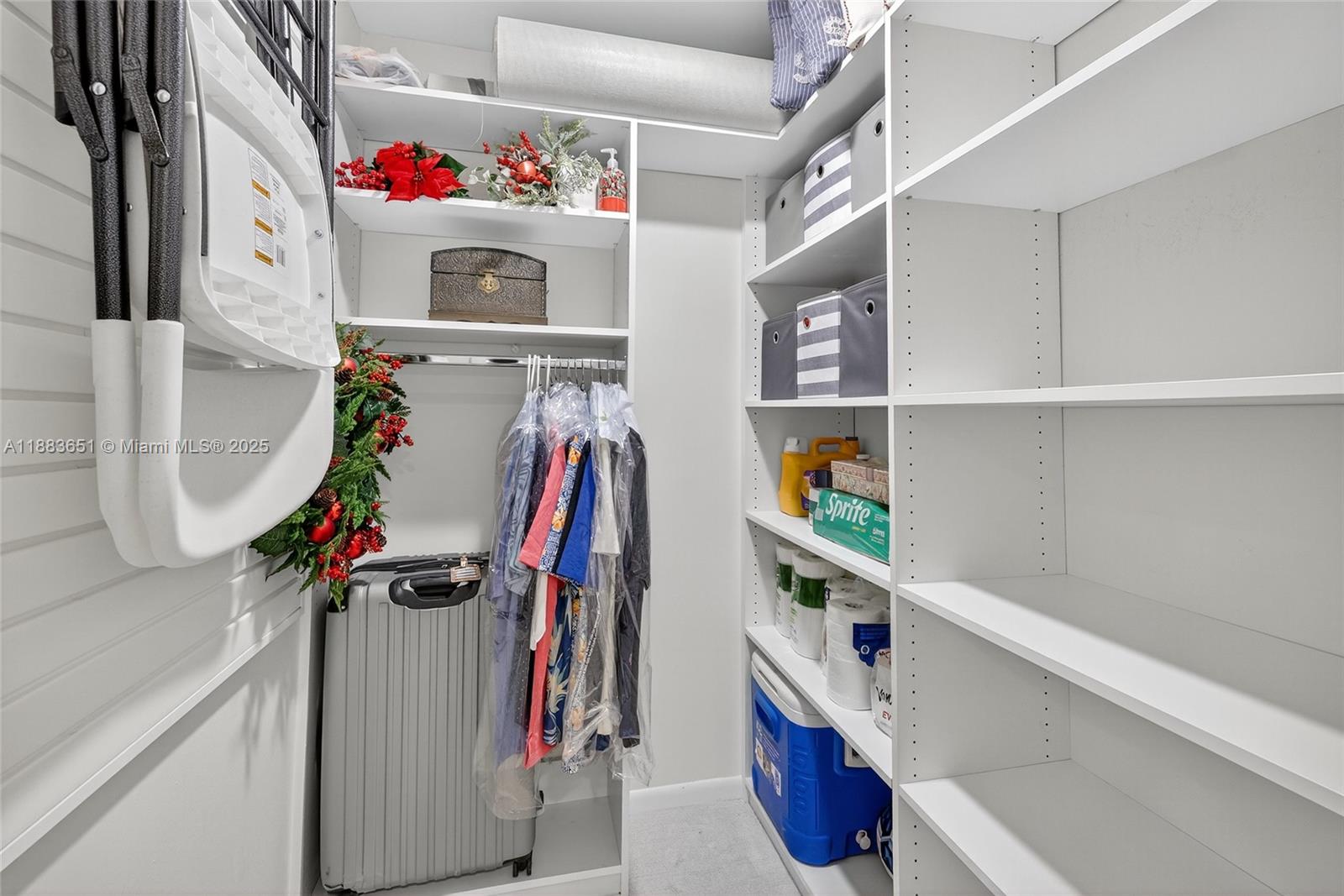 21695 Arriba Real Boca Raton, FL 33433 - Photo 29 of 61 a view of walk in closet with clothes and shoes