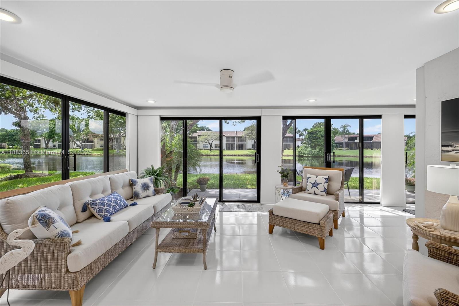 21695 Arriba Real Boca Raton, FL 33433 - Photo 35 of 61 a living room with furniture and a large window