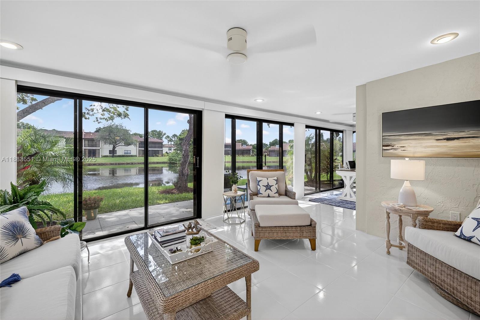 21695 Arriba Real Boca Raton, FL 33433 - Photo 36 of 61 a living room with furniture and a large window