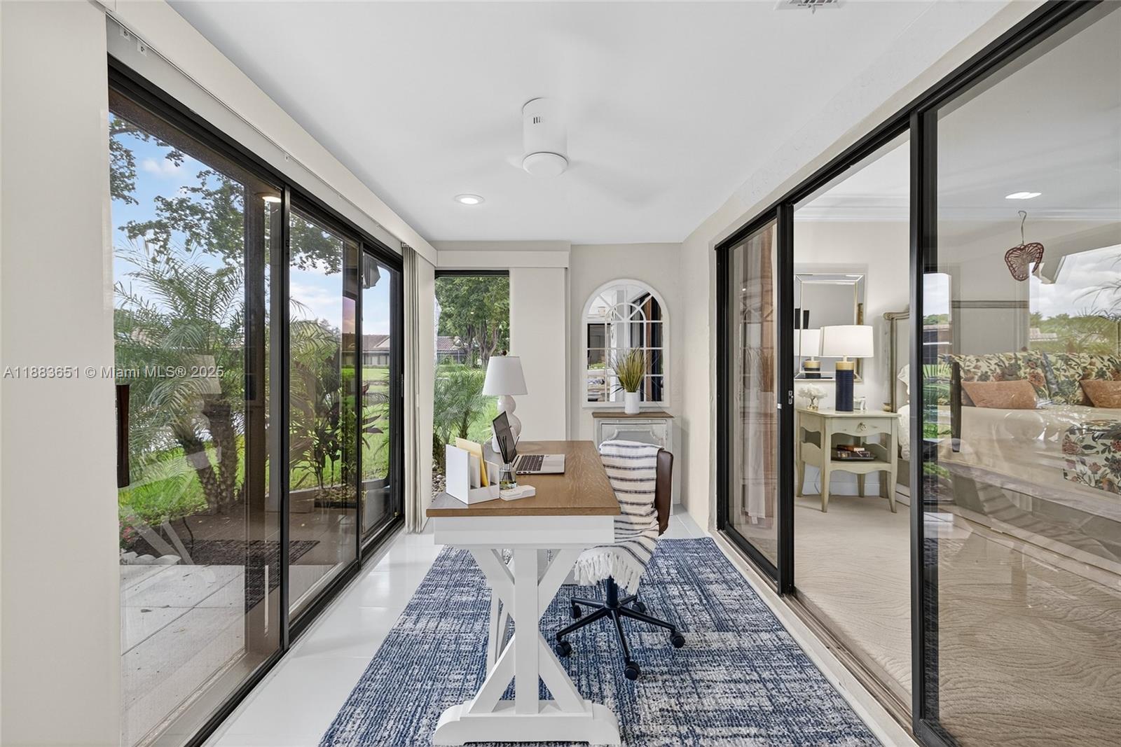 21695 Arriba Real Boca Raton, FL 33433 - Photo 38 of 61 a living room with a large window and furniture