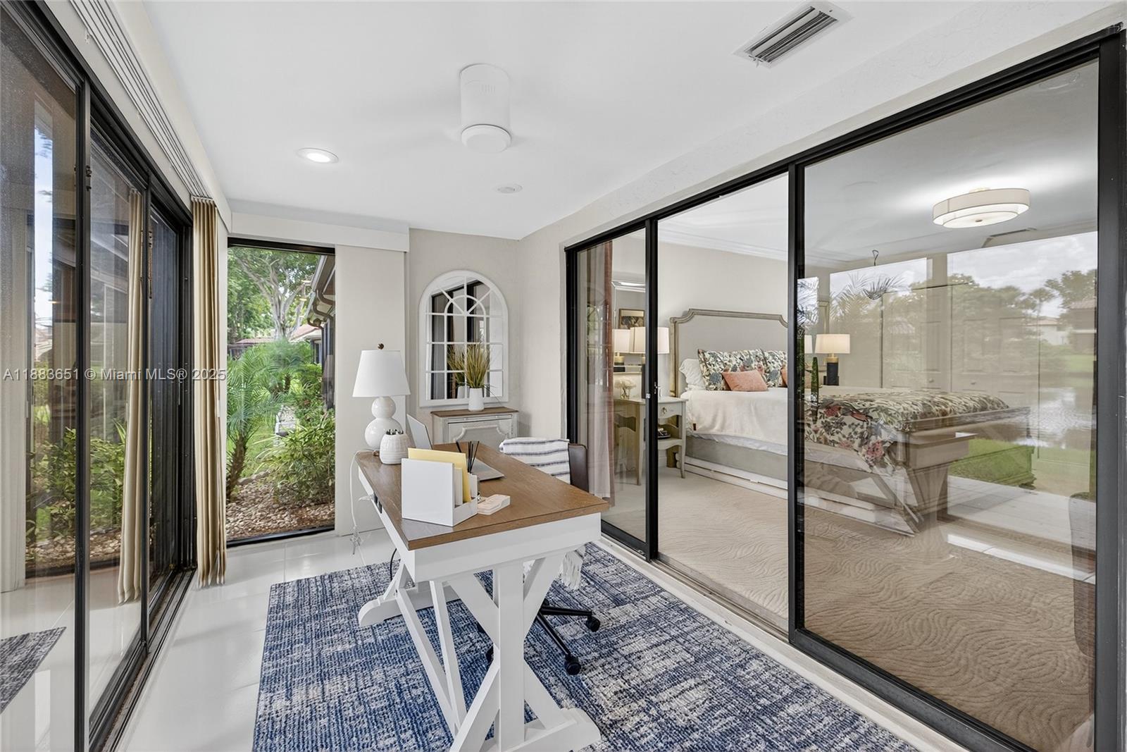 21695 Arriba Real Boca Raton, FL 33433 - Photo 39 of 61 a living room with hardwood floor and a large window