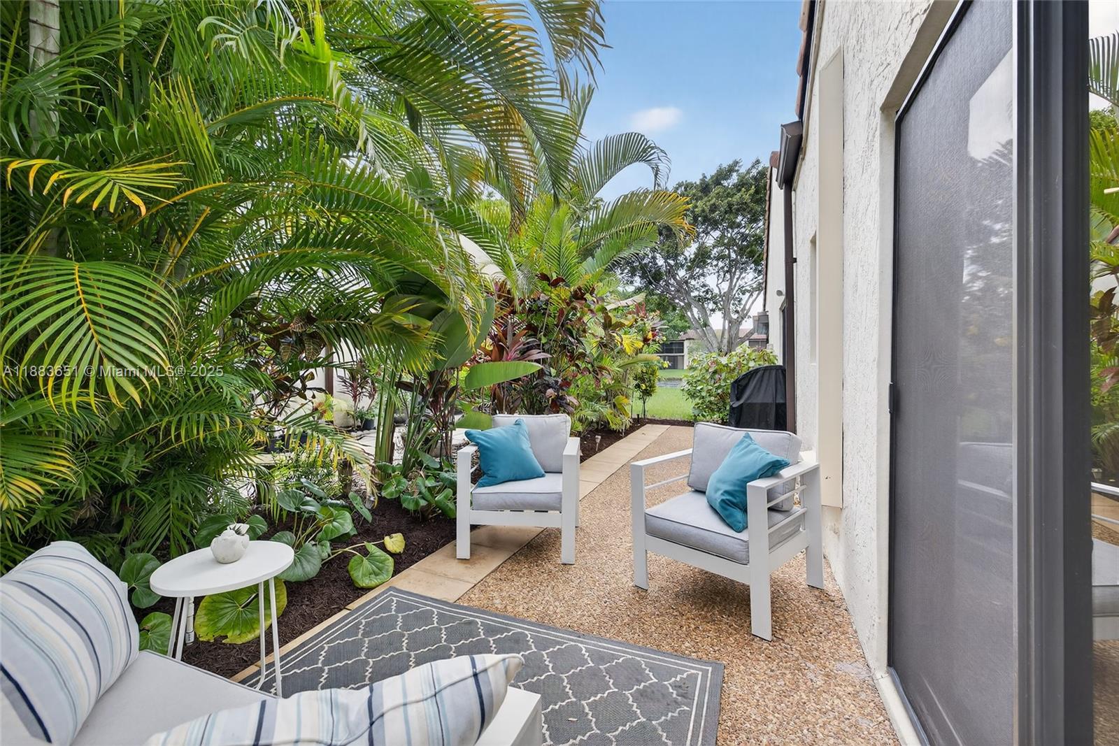 21695 Arriba Real Boca Raton, FL 33433 - Photo 43 of 61 a view of a chairs and table in a balcony