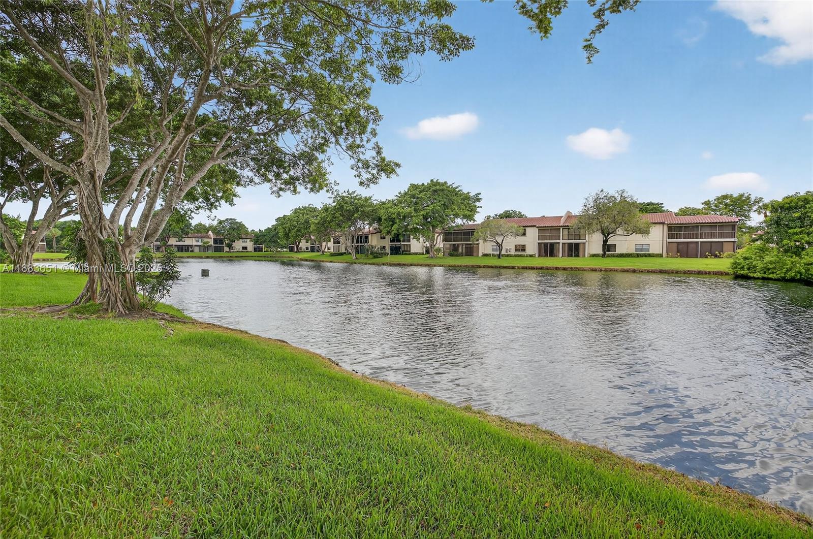 21695 Arriba Real Boca Raton, FL 33433 - Photo 50 of 61 a view of a lake with houses in the back