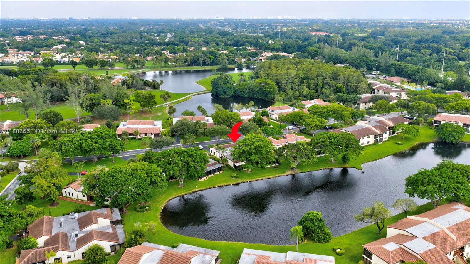21695 Arriba Real Boca Raton, FL 33433 - Photo 55 of 61 an aerial view of a house with a garden and lake view