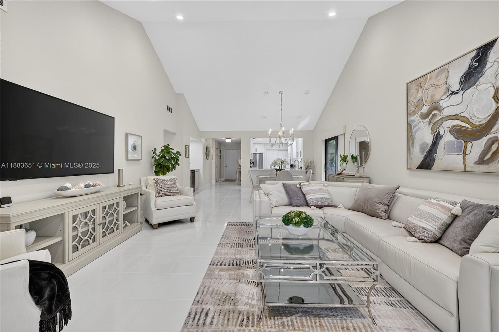 21695 Arriba Real Boca Raton, FL 33433 - Photo 6 of 61 a living room with furniture and a flat screen tv