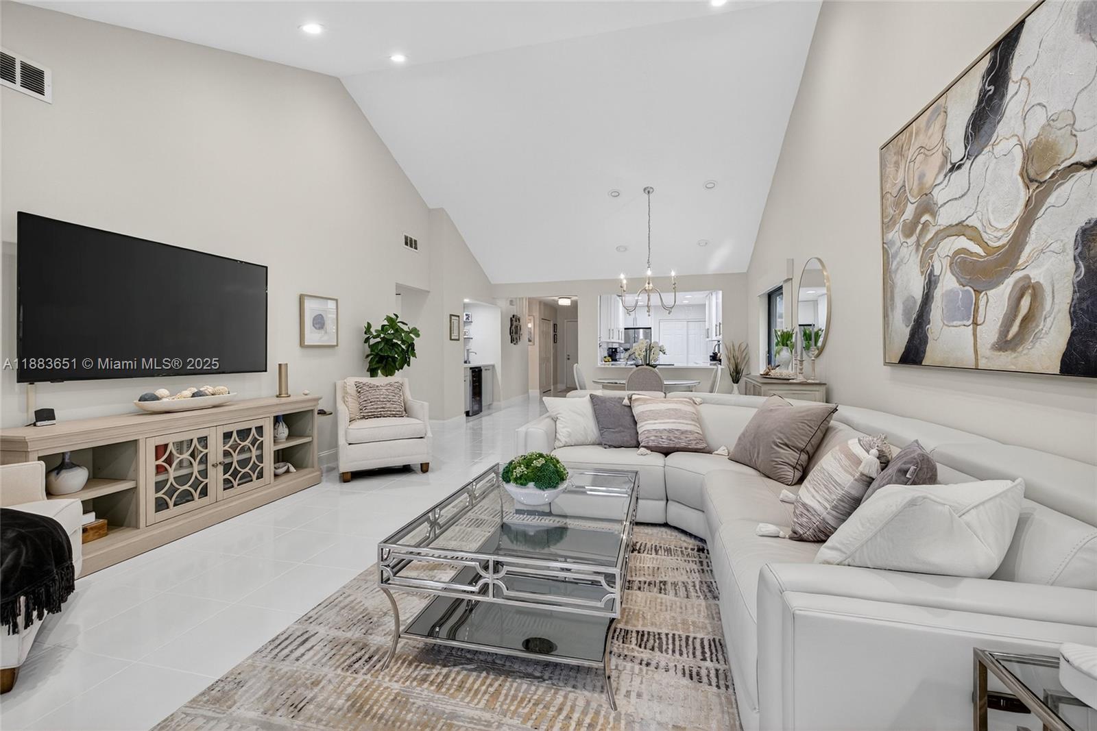 21695 Arriba Real Boca Raton, FL 33433 - Photo 7 of 61 a living room with furniture and a flat screen tv
