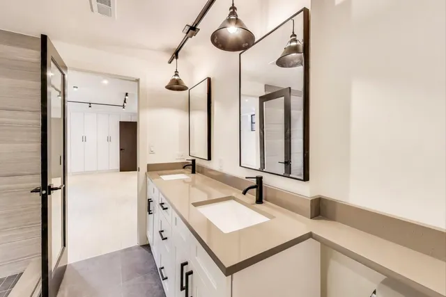 a bathroom with a sink and a shower