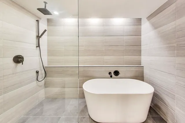 a bathroom with a sink and shower