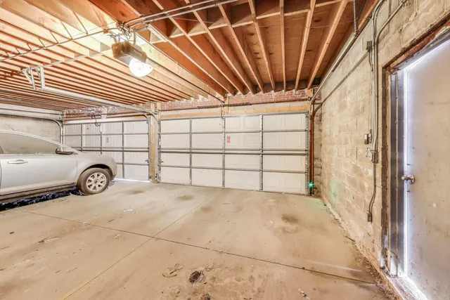 front view of a building with large trees