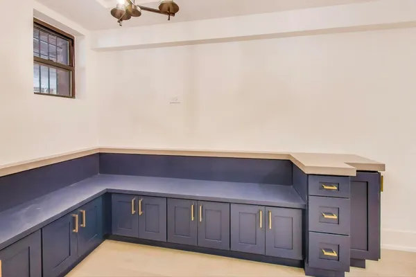 a kitchen with a sink and cabinets