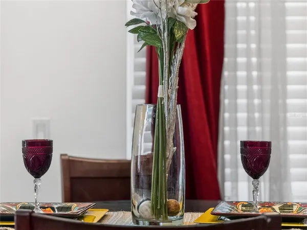 a living room with furniture and a mirror
