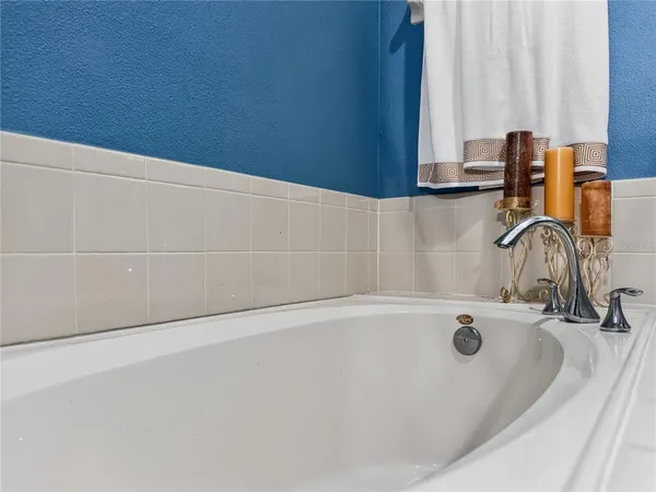 a bathroom with a sink and a window