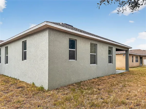 a house view with a backyard