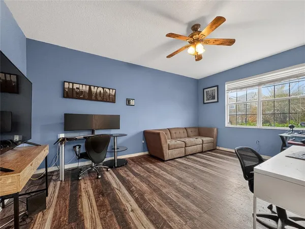 a bedroom with a workspace