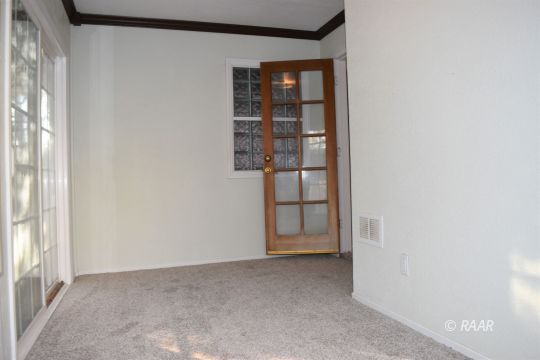 217 Kennedy Court Ridgecrest, CA 93555 - Photo 23 of 28 a view of a small space with racks on the wall
