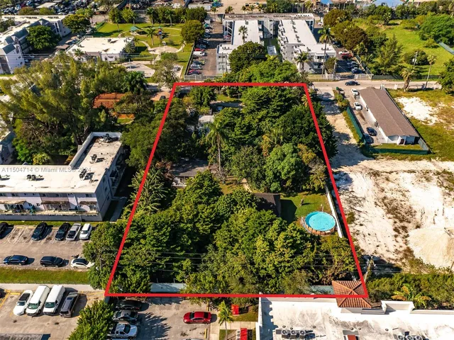 an aerial view of residential houses with outdoor space