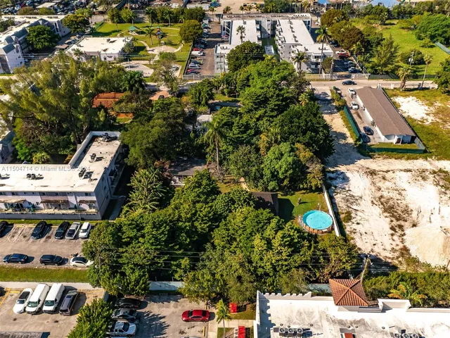 an aerial view of residential houses with outdoor space
