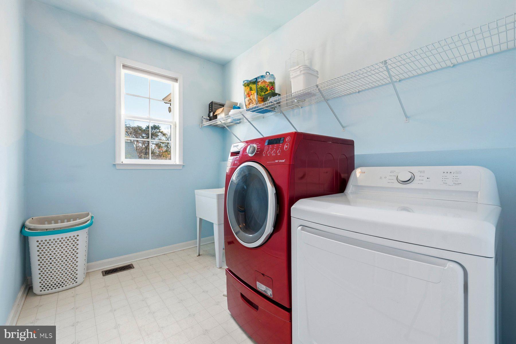 7810 Grandison Way Severn, MD 21144 - Photo 17 of 50 a utility room with dryer and washer
