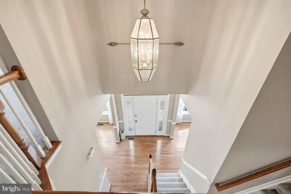 a front view of a house with wooden floor and white walls
