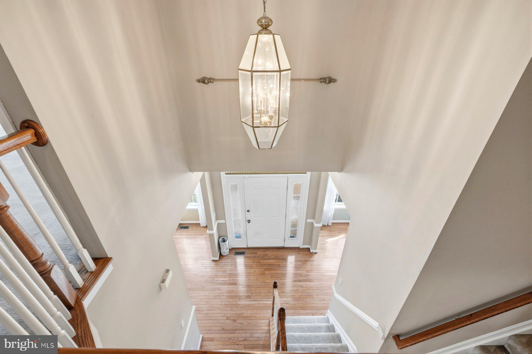 7810 Grandison Way Severn, MD 21144 - Photo 18 of 50 a front view of a house with wooden floor and white walls