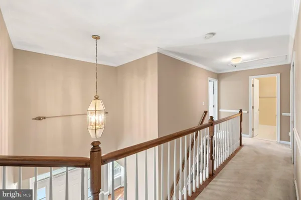 a view of a hallway view with staircase