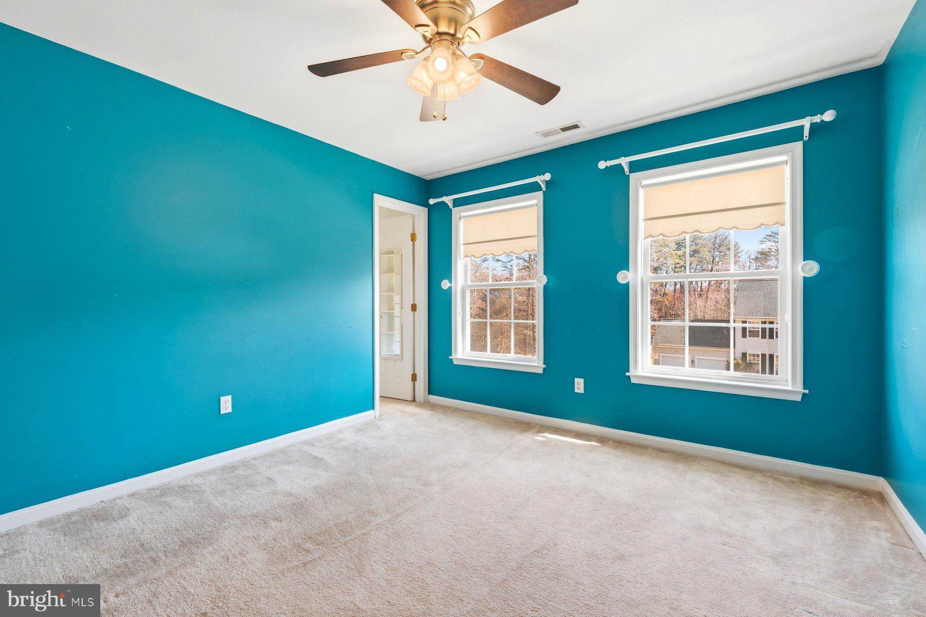 7810 Grandison Way Severn, MD 21144 - Photo 23 of 50 a view of empty room with window and ceiling fan