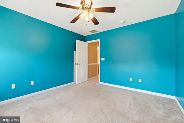 a view of a room with a fan