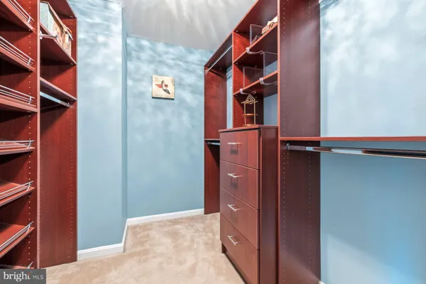 a bathroom with a sink double vanity granite tub shower and a mirror
