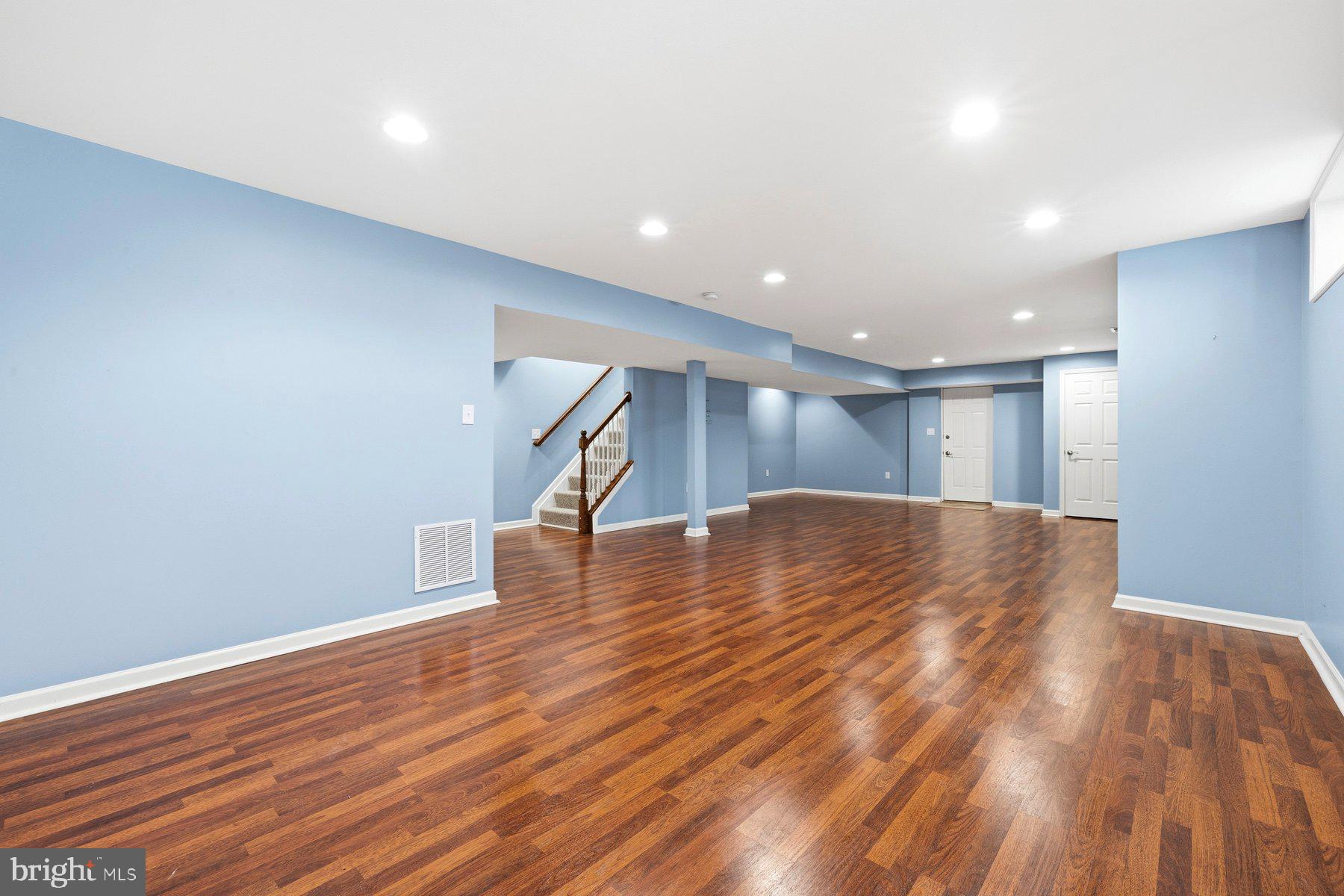 7810 Grandison Way Severn, MD 21144 - Photo 37 of 50 a view of empty room with wooden floor