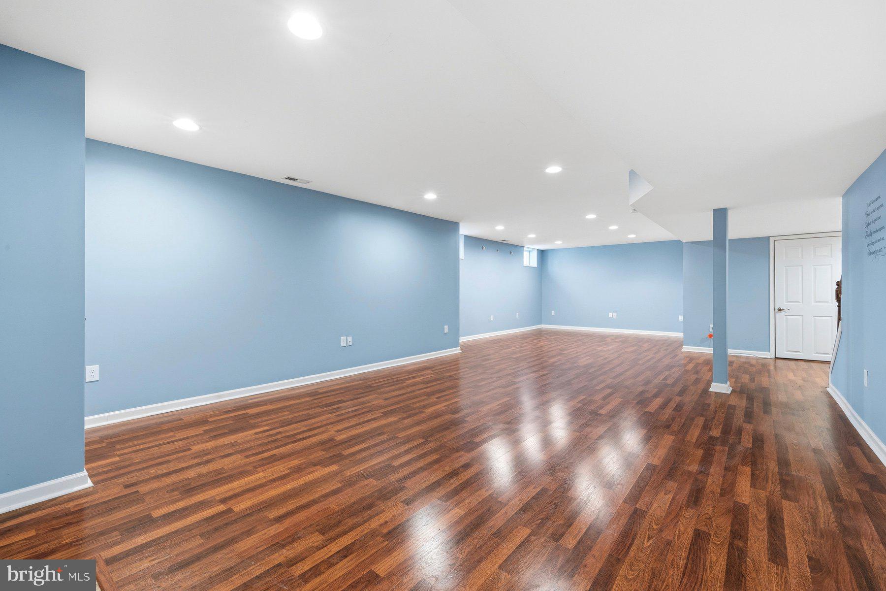 7810 Grandison Way Severn, MD 21144 - Photo 38 of 50 a view of empty room with wooden floor