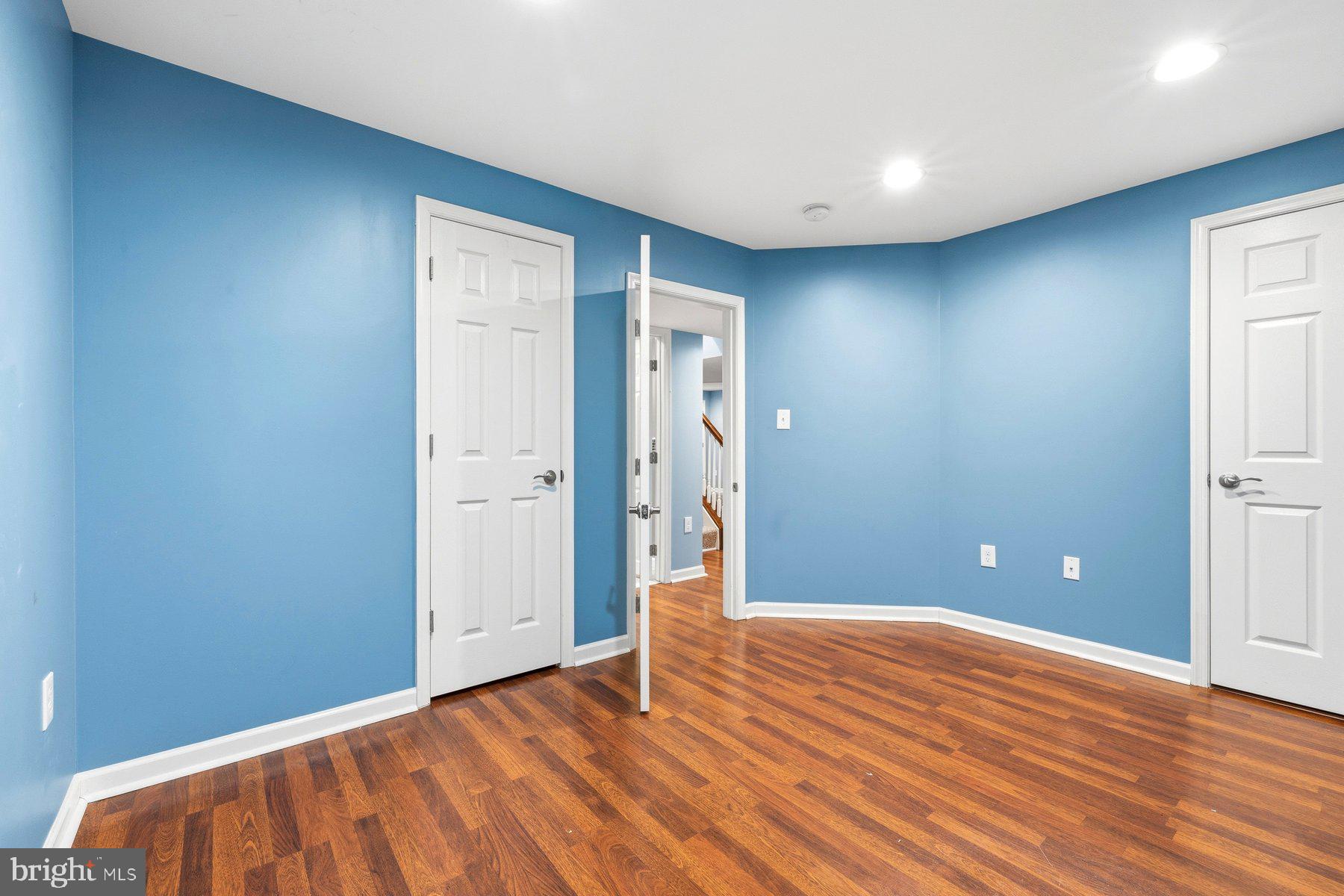 7810 Grandison Way Severn, MD 21144 - Photo 42 of 50 a view of empty room with wooden floor