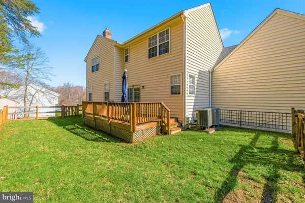 a view of swimming pool with garden and seating area