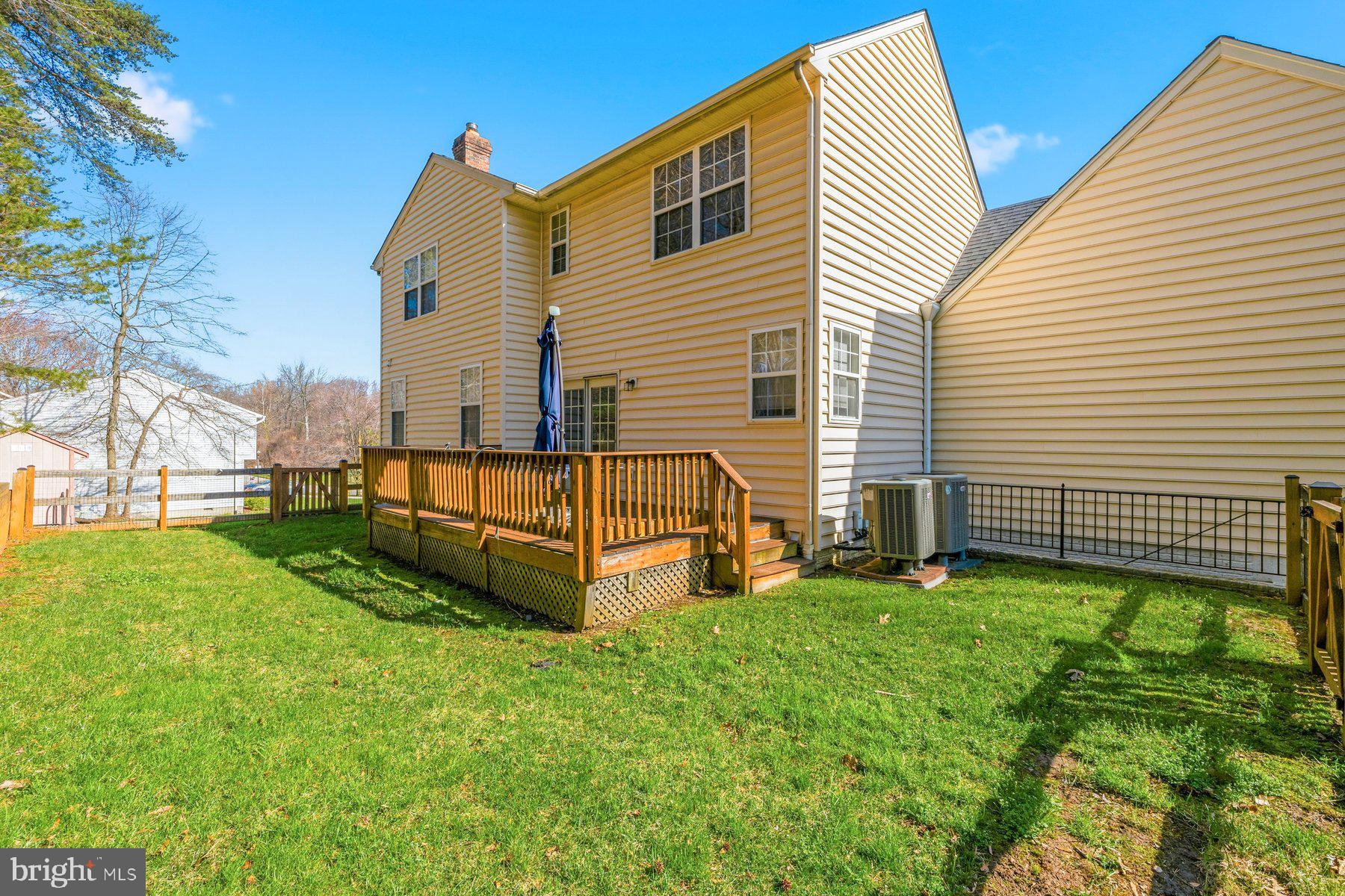7810 Grandison Way Severn, MD 21144 - Photo 46 of 50 a view of a house with a backyard