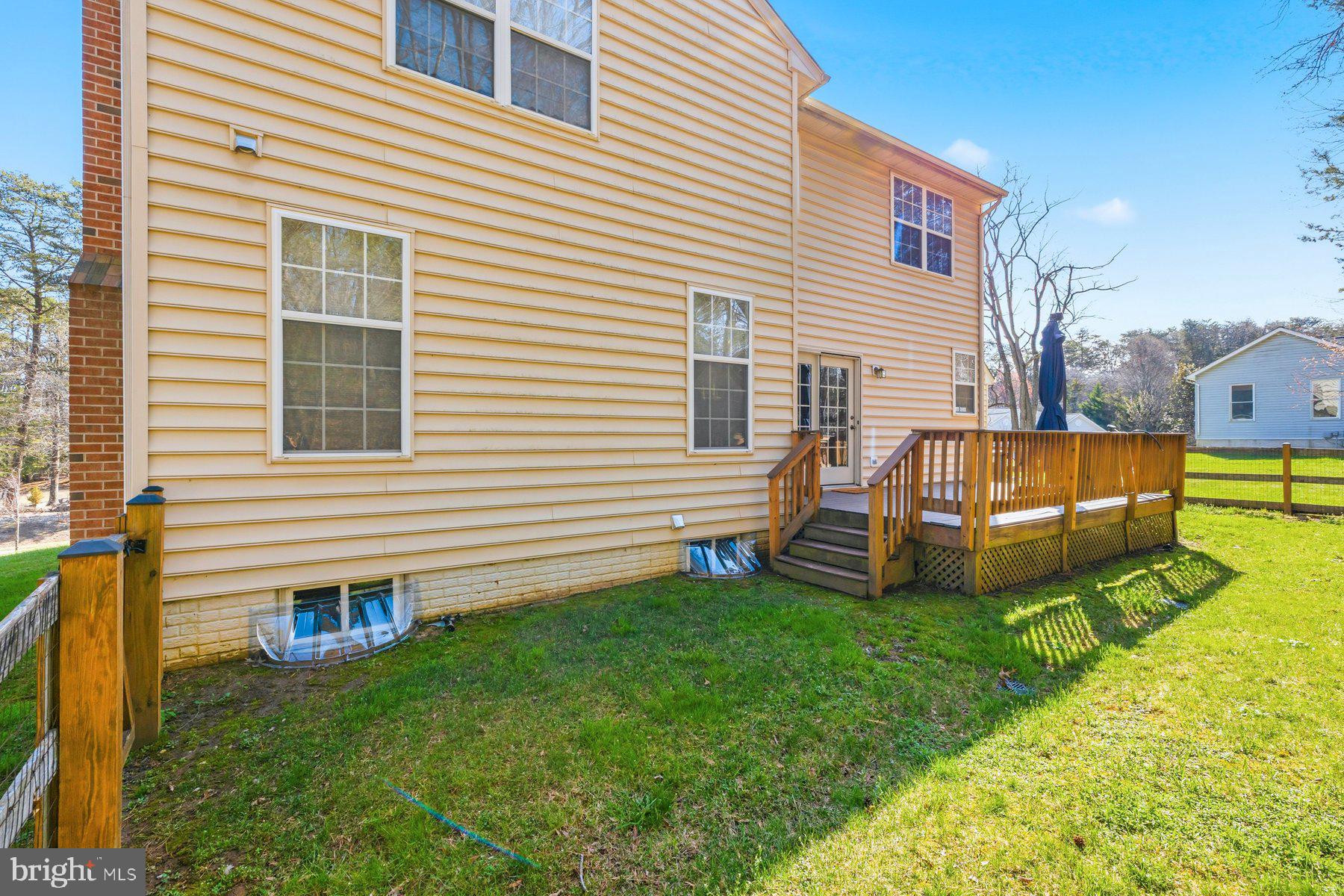 7810 Grandison Way Severn, MD 21144 - Photo 47 of 50 a view of a house with a backyard