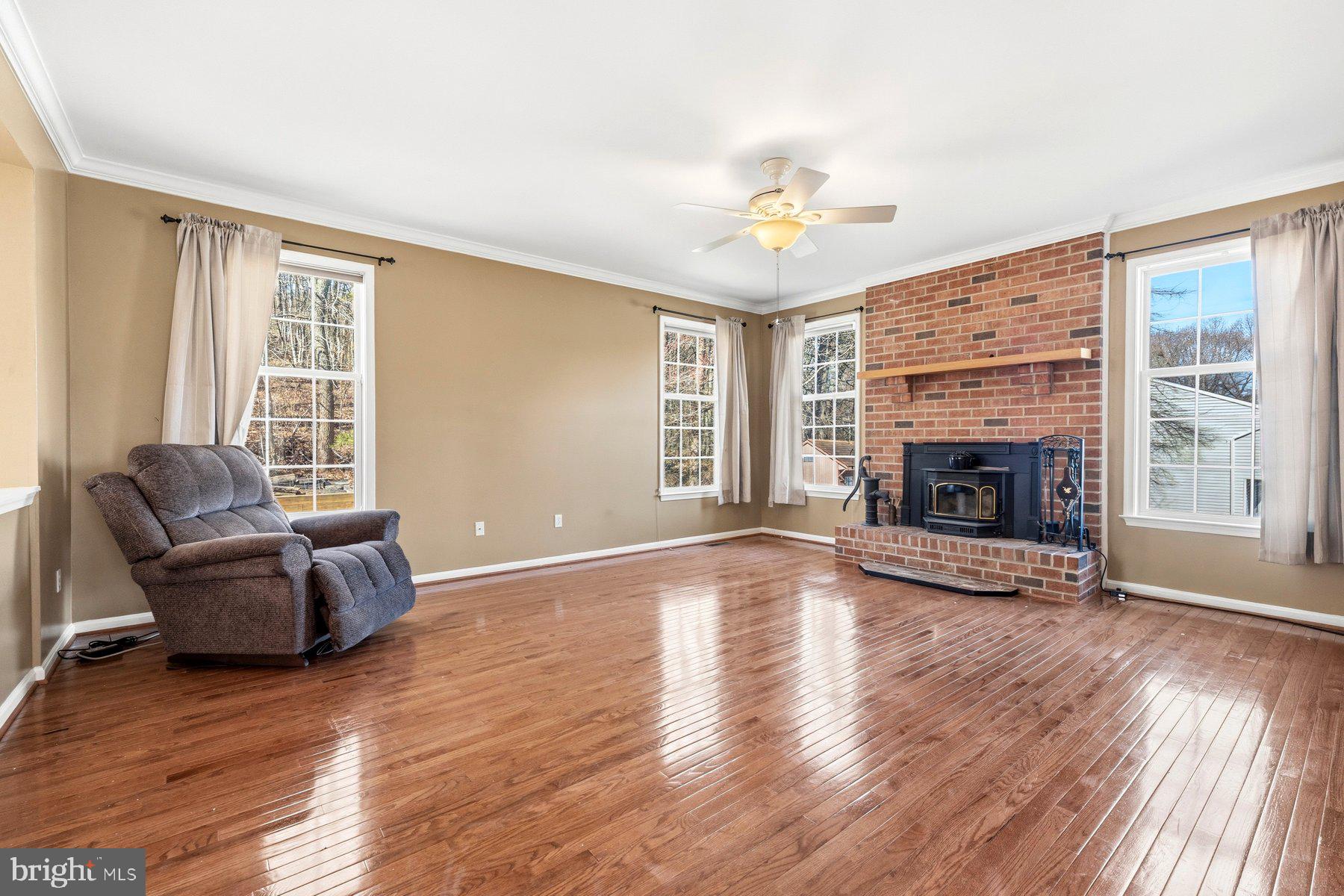 7810 Grandison Way Severn, MD 21144 - Photo 9 of 50 a view of livingroom with fireplace hardwood floor and living room