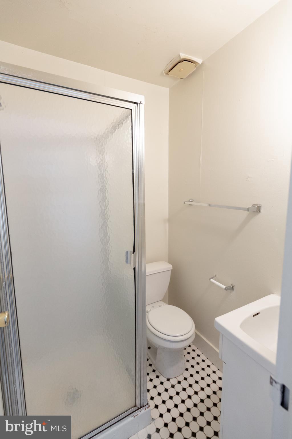 2311 Spruce Street, Unit 203 Philadelphia, PA 19103 - Photo 30 of 33 a bathroom with a shower a toilet and a sink