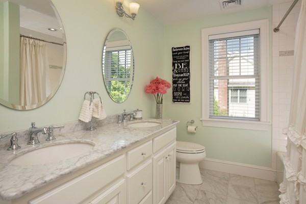 25 Patton Road Wellesley, MA 02482 - Photo 14 of 20 a bathroom with a granite countertop toilet a sink and a mirror